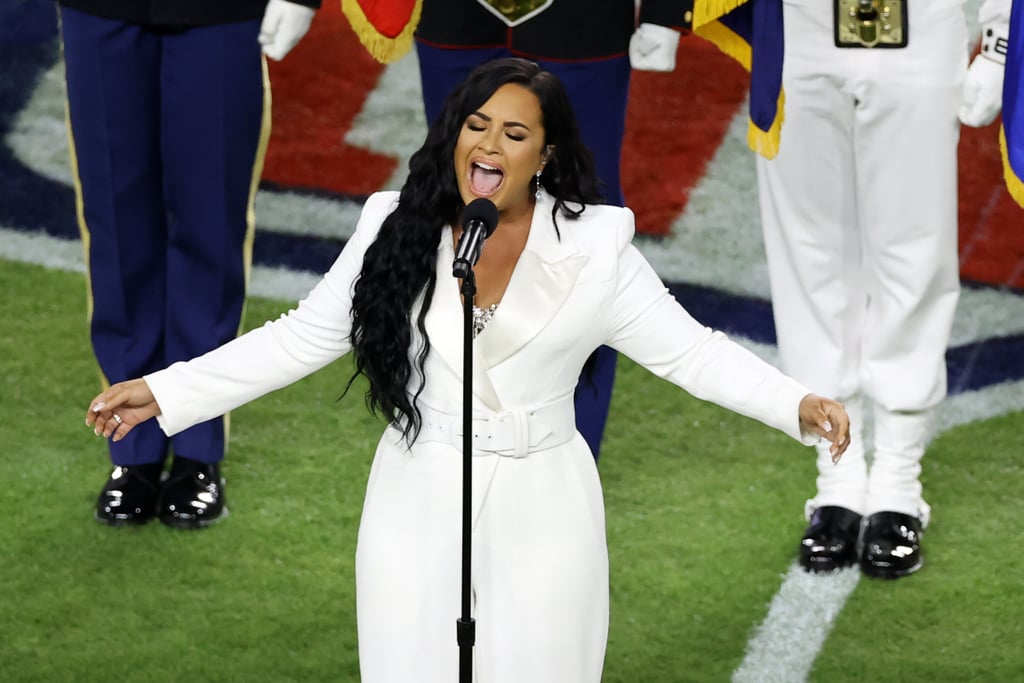 Demi Lovato's White Sergio Hudson Jumpsuit at the Super Bowl