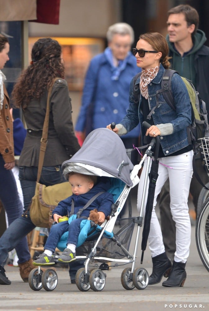 Natalie Portman juxtaposed a dark denim jacket and white jeans while hanging out with son Aleph in LA. A printed scarf broke up the look, while Westward Leaning sunglasses injected further cool.