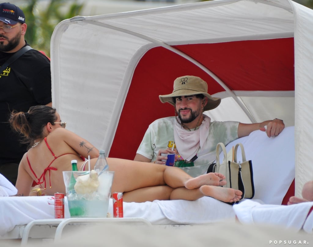 Bad Bunny is celebrating the success of his latest album, "Un Verano Sin Ti." After the 28-year-old global superstar dropped the surprise album on Friday, he hit up the beach in Miami with girlfriend Gabriela Berlingeri for some well-deserved R&R on May 7. The couple were photographed enjoying the sunny weather as they kicked back in a beach cabana and walked along the beach with their bodyguards following closely.
Bad Bunny's "Un Verano Sin Ti" is already shaping up to be one of the biggest albums of the year. On the day of the album's release, the singer made history as Spotify's most-streamed artist of all time, and the project broke the record for streams in a single day, with 183 million. Drake previously held the record with 176.8 million streams for "Certified Lover Boy." Bad Bunny's "Un Verano Sin Ti" is also currently the most-streamed album of 2022 so far. "It's a record to play in the summer, on the beach, as a playlist," Bad Bunny told The New York Times, adding: "The album is very Caribbean, in every sense: with its reggaeton, its mambo, with all those rhythms, and I like it that way."
On top of his album release, Bad Bunny is starring alongside Brad Pitt in the action-packed film "Bullet Train," set to hit theaters on July 15. The film also features Sandra Bullock, Aaron Taylor-Johnson, Joey King, Zazie Beetz, Michael Shannon, Brian Tyree Henry, Hiroyuki Sanada, Logan Lerman, and Andrew Koji. 
And if that wasn't exciting enough, Bad Bunny is also suiting up to become a Marvel superhero, El Muerto, in an upcoming Sony Pictures movie. "It's amazing. It's incredible. I love wrestling. I grew up watching it and now I'm a wrestler," he said at CinemaCon back in April. "This is why I love this character. I think it's the perfect role to me. It will be epic." El Muerto will be the first Latinx superhero to headline their own Marvel movie.

    Related:

            
            
                                    
                            

            Bad Bunny&apos;s New "Un Verano Sin Ti" Is a Testament to the Evolvement of Latin Music