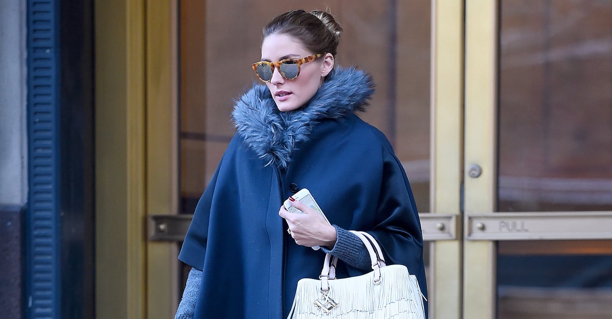 Olivia Palermo in fur coat with purple bag and white sneakers in