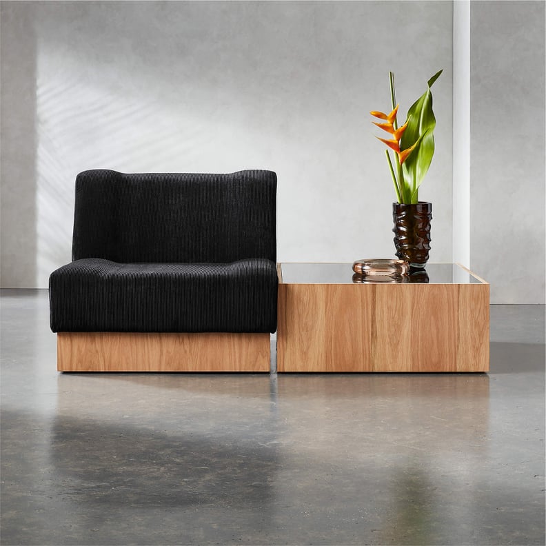 An Armless Chair: CB2 Vaneri Black Corduroy Armless Chair