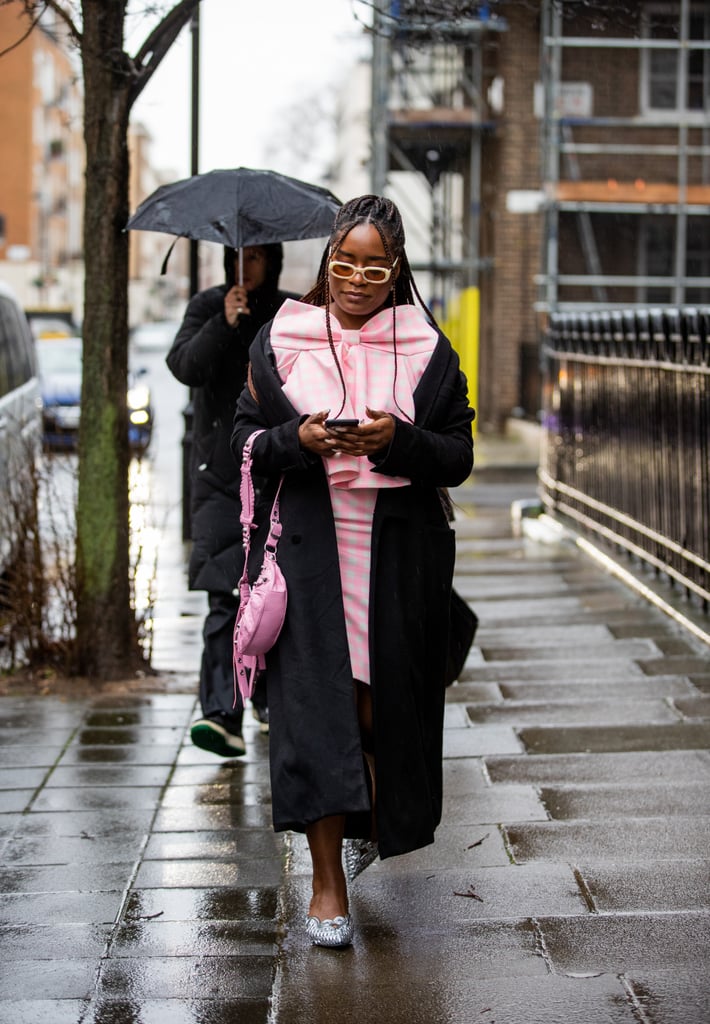 Pink gingham is a fun trend to try for spring/summer 2022. We love how the black coat adds depth to the massive pink bow.