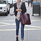 A scarf is an easy way to amp up your day to day; then do like Miranda and swap out your flats for booties to really hit that street-chic edge.