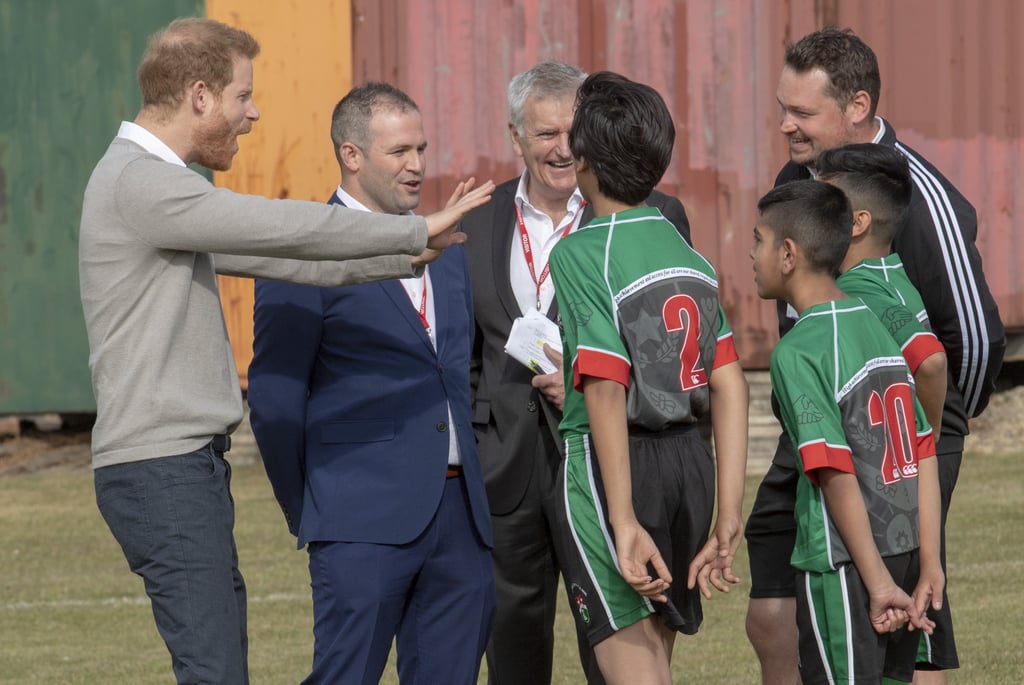 Prince Harry Hugs Kids at Lealands High School