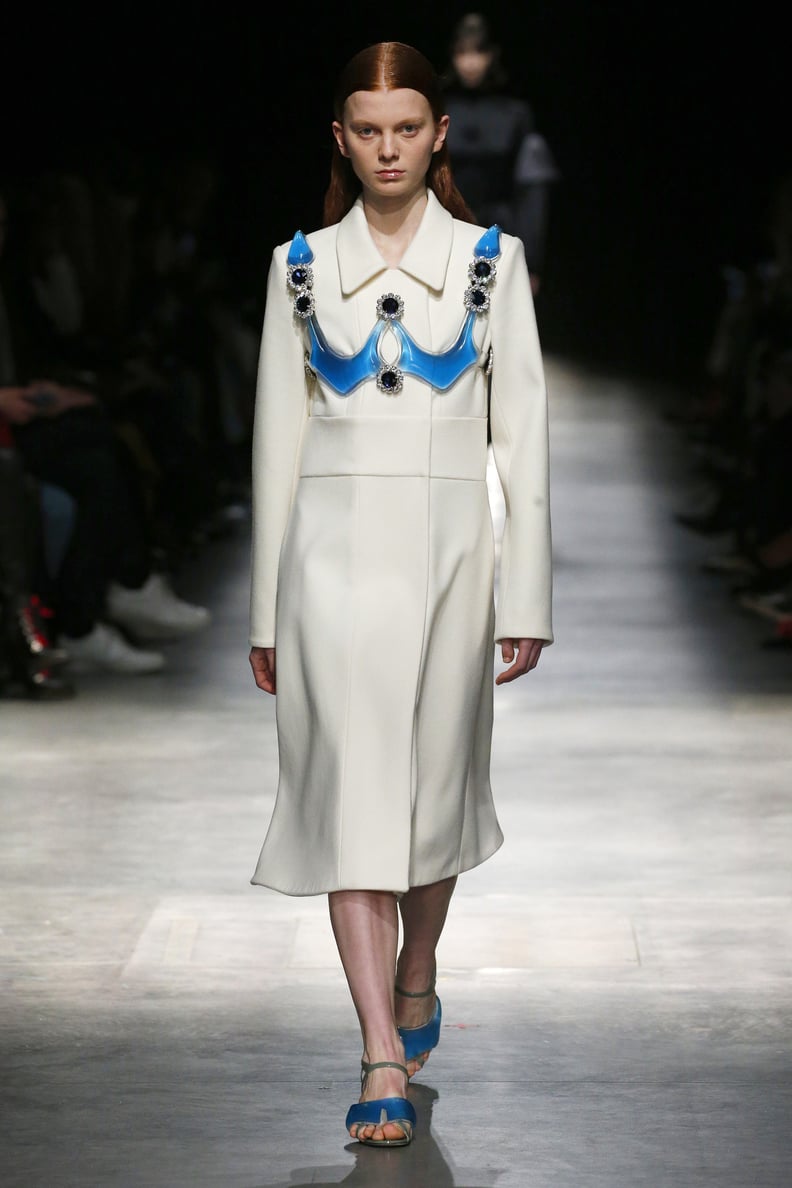 A White Coat With a Gel Harness From the Christopher Kane Fall 2020 Runway at London Fashion Week