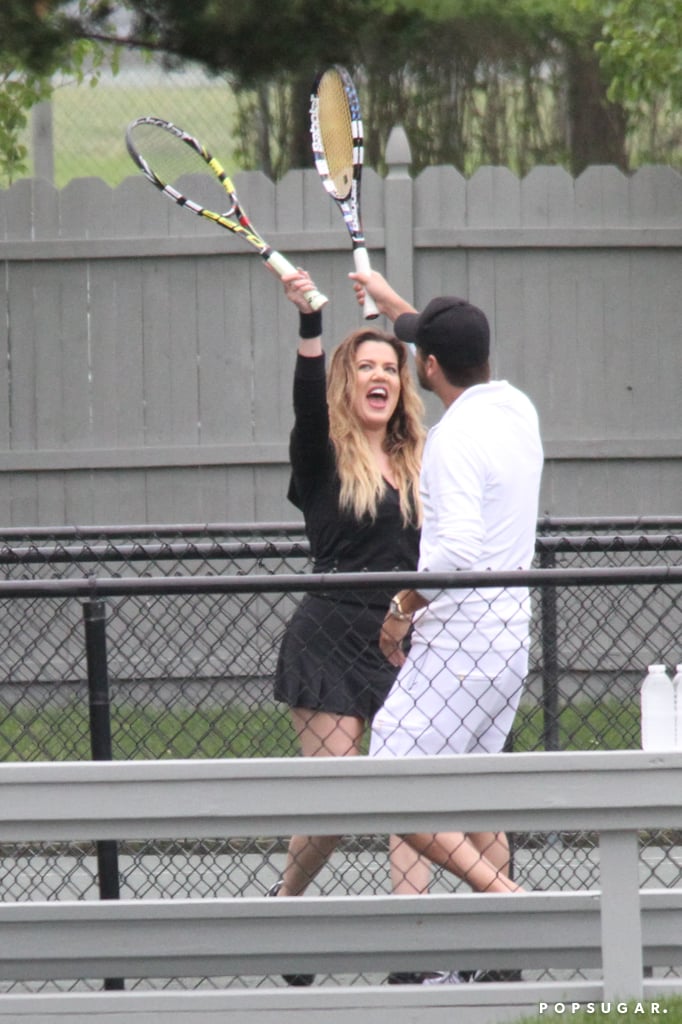 Khloé Kardashian and Scott Disick high fived with their tennis rackets in the Hamptons on Thursday.
