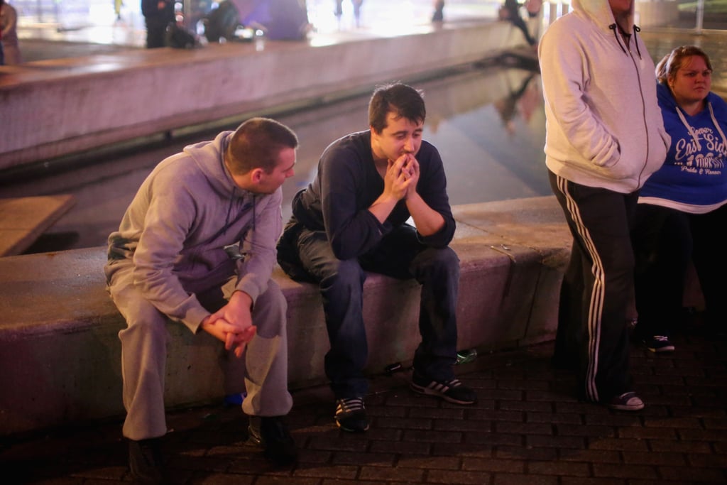 A group of "Yes" supporters consoled themselves outside the Scottish Parliament building in Edinburgh.