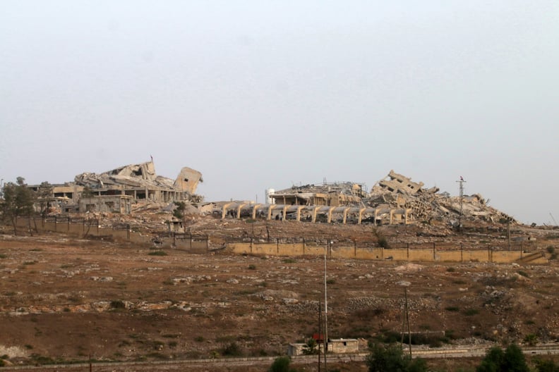 Syrian forces gather at a hospital in Aleppo that they recaptured from the rebels, who held it since 2013.