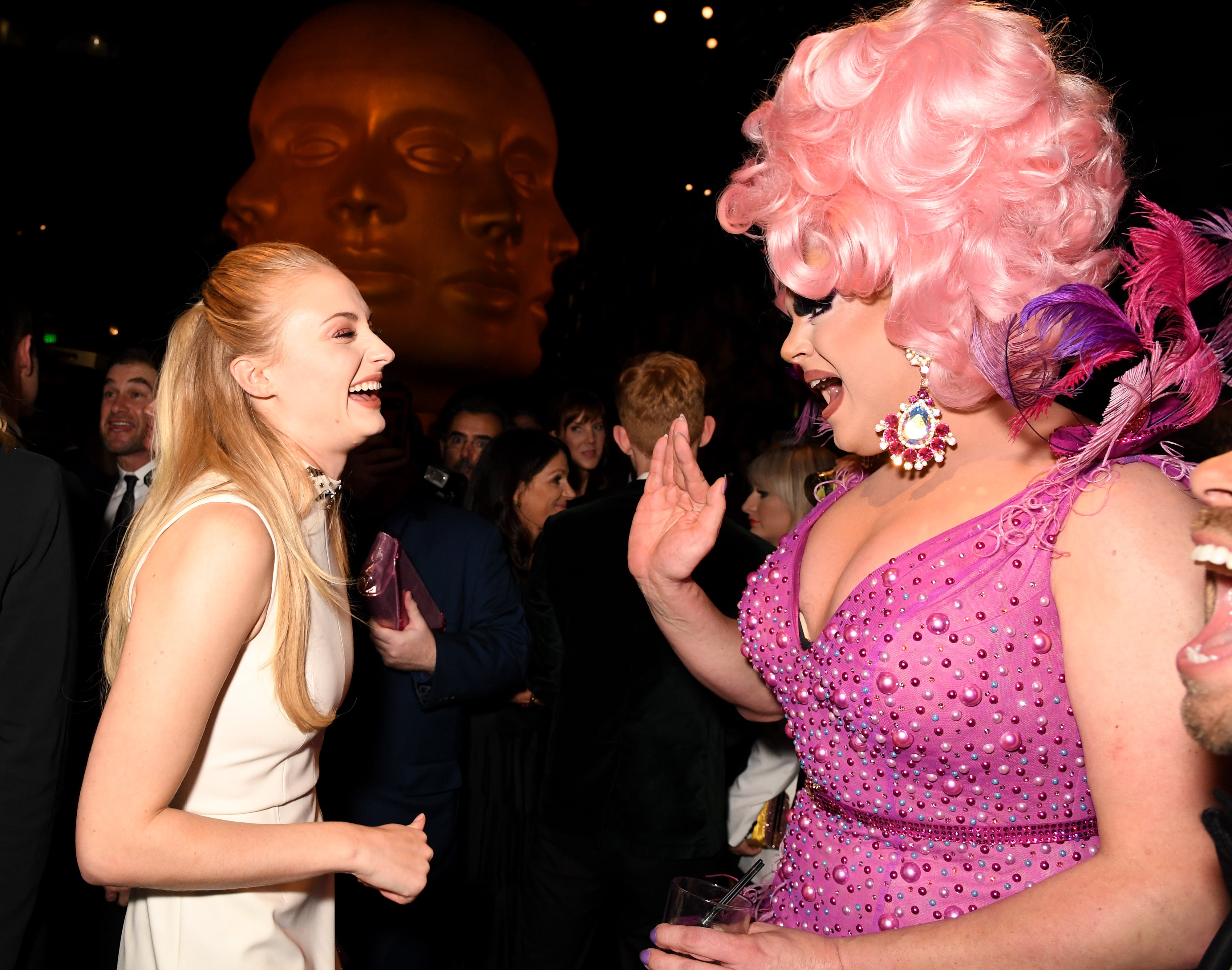 Sophie Turner Goes Solo to 2019 Emmys in Feminine Pink Gown While