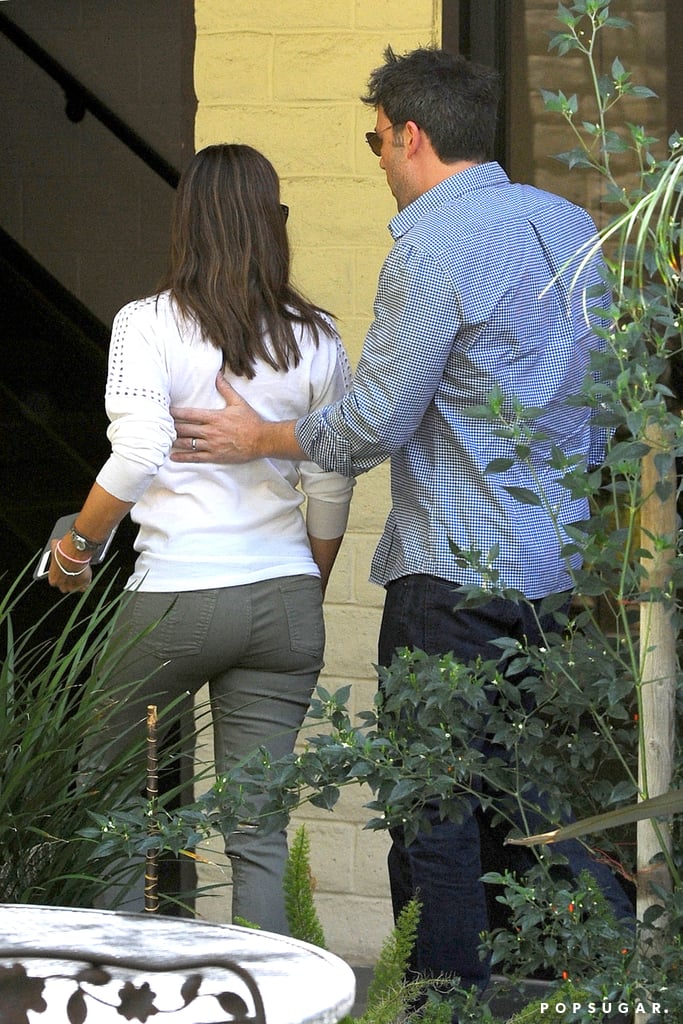 Ben placed his hand on his wife Jennifer's back as they had a couple's outing in LA in July 2013.