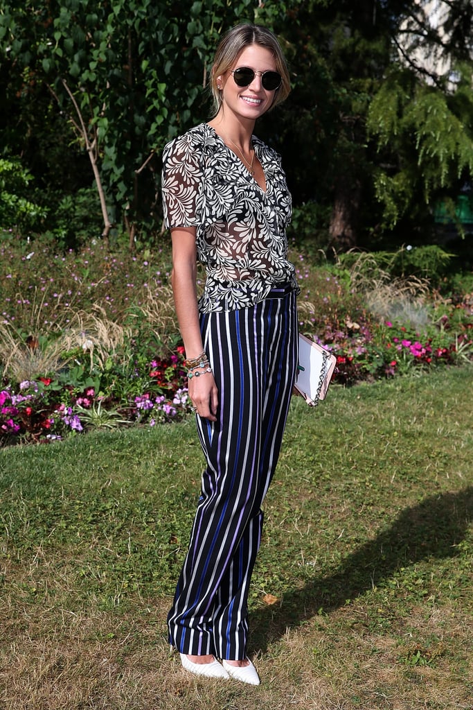 Street style star Helena Bordon showed off her print-mixing skills in a pair of leg-lengthening vertical-striped trousers.