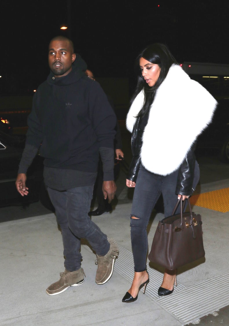 For a trip to LAX, Kim worked a fur; Kanye worked his hoodie.