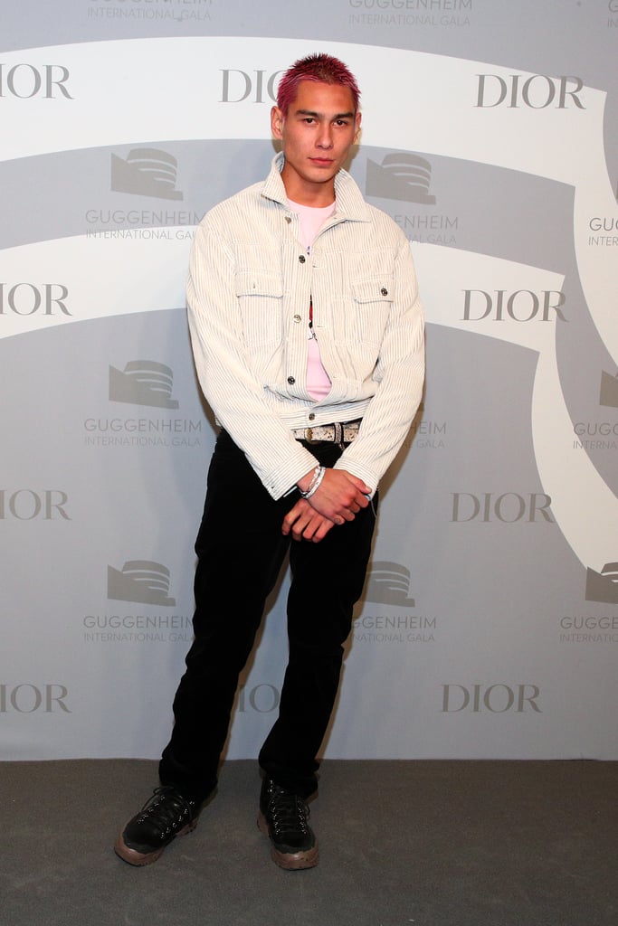 Attending a Dior event wearing a white jacket and dark jeans.