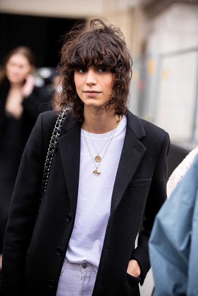 Layered necklaces instantly dress up a blazer-and-tee combo.