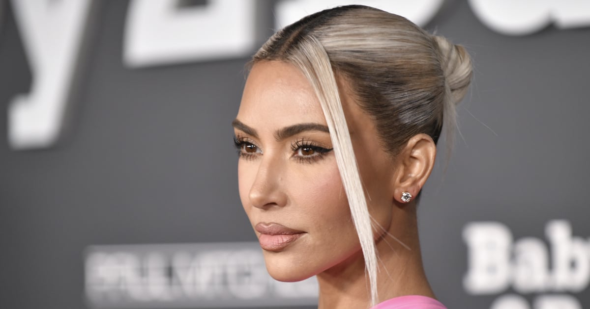 Kim Kardashian Wears a Silver Versace Gown For Christmas