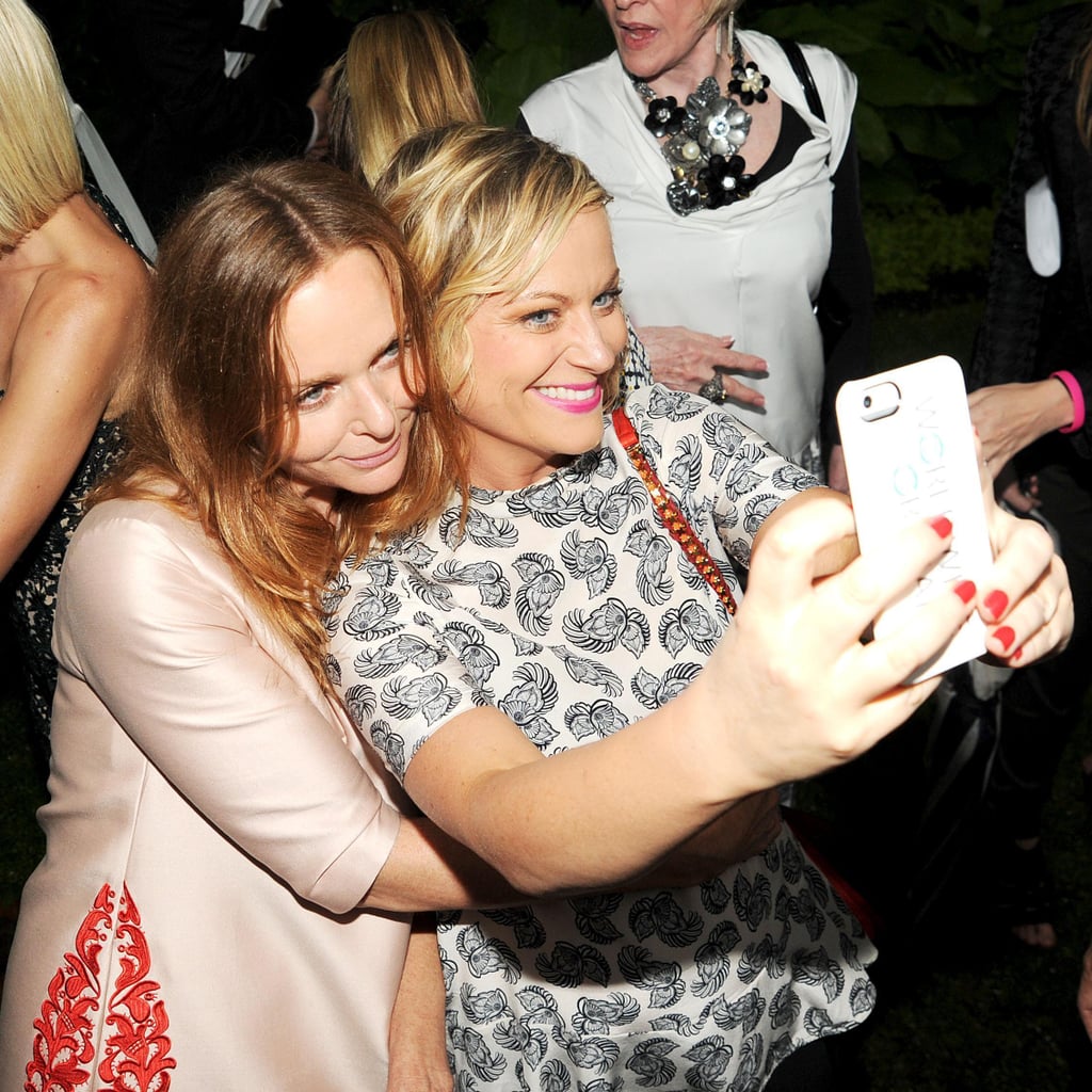 In June 2013, Amy Poehler snapped a selfie with Stella McCartney at Stella's Spring 2014 presentation in NYC.
