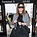 Chrissy Teigen Wearing Black Stiletto Booties at Airport