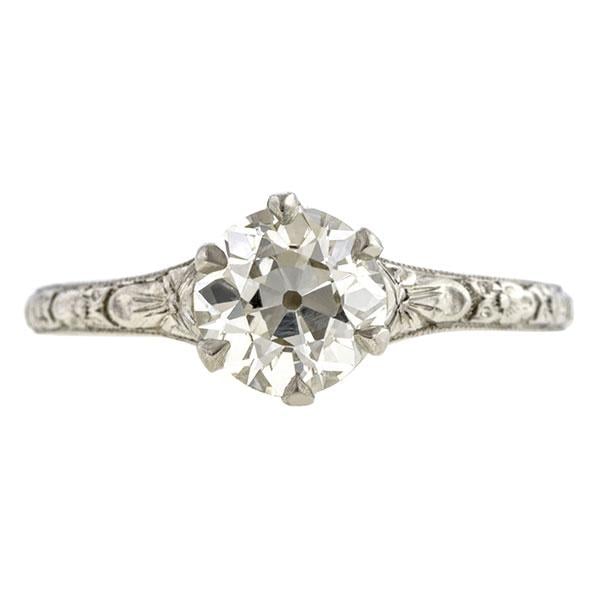 "Our flower engagement ring lets the focus remain on the centre stone but has a beautiful patterned band to add details and symbolism. The flower blossoms on the band are orange blossoms. Queen Victoria popularized these when she wore them to her wedding to Prince Albert. The blossom represents fruitfulness."