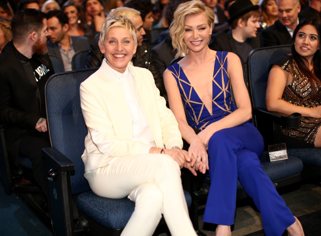 Ellen DeGeneres and Portia De Rossi cozied up in their seats.