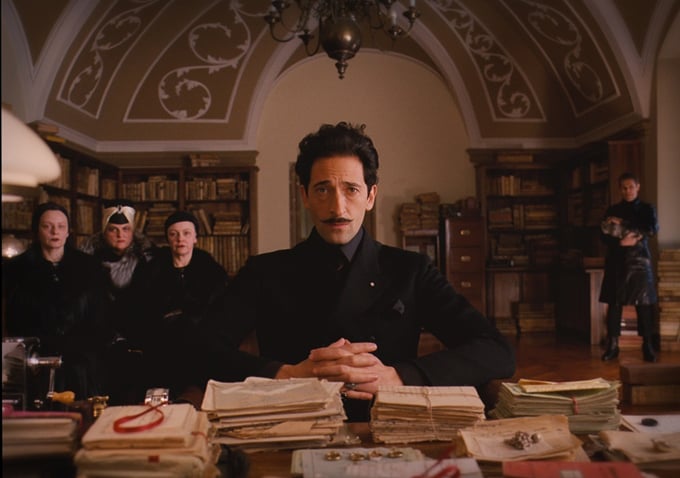 Dmitri (Adrien Brody) puts on a serious face.