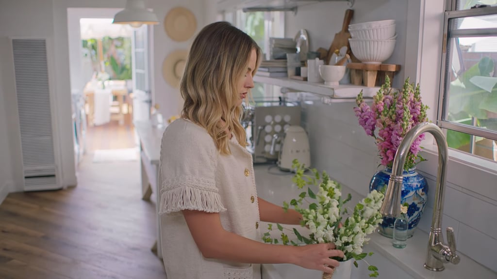Margot delicately arranging flowers is what I'd like to imagine myself doing on any given weekend instead of watching old seasons of America's Next Top Model or what have you. I also love that crisp white Smeg Electric Kettle.