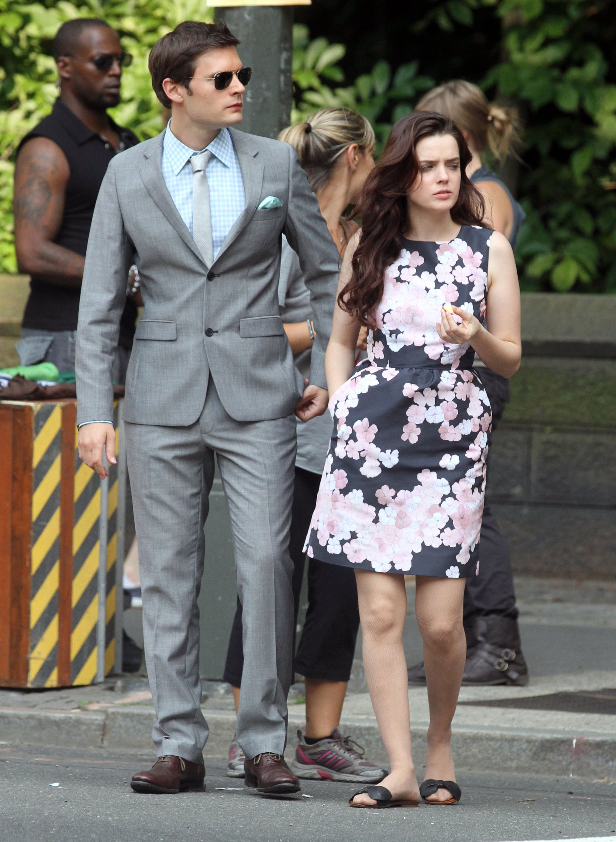 Hugo Becker in a slick gray suit and newcomer Roxane Mesquida ...