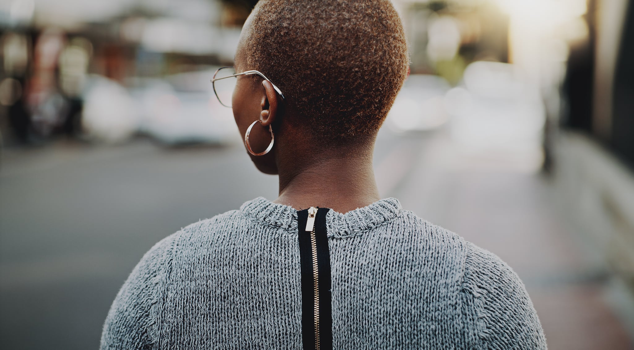 Rearview shot of a young businesswoman walking outdoors in the city