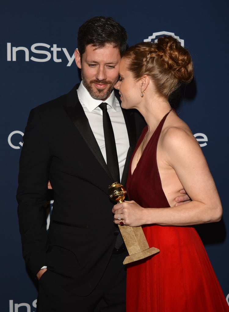 Amy Adams shared a sweet moment with Darren Le Gallo as she clutched her shiny new Golden Globe at the party.
