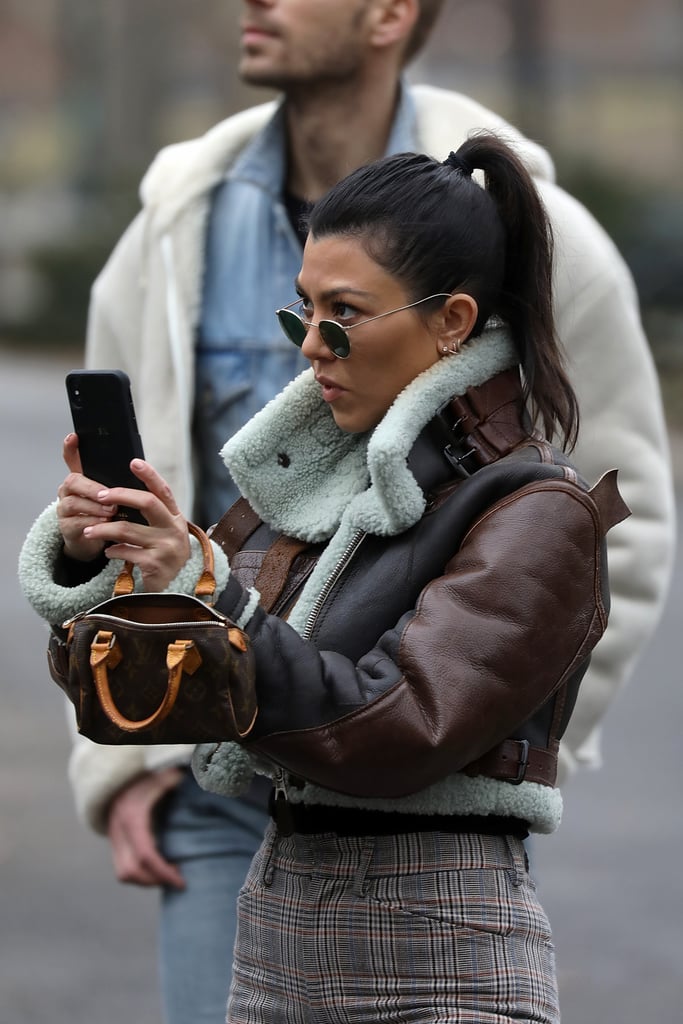 This is pretty much Kourtney's all-purpose mini purse. She rocked it with a cropped Balenciaga shearling jacket and plaid pants for an ice skating jaunt with family in Central Park.