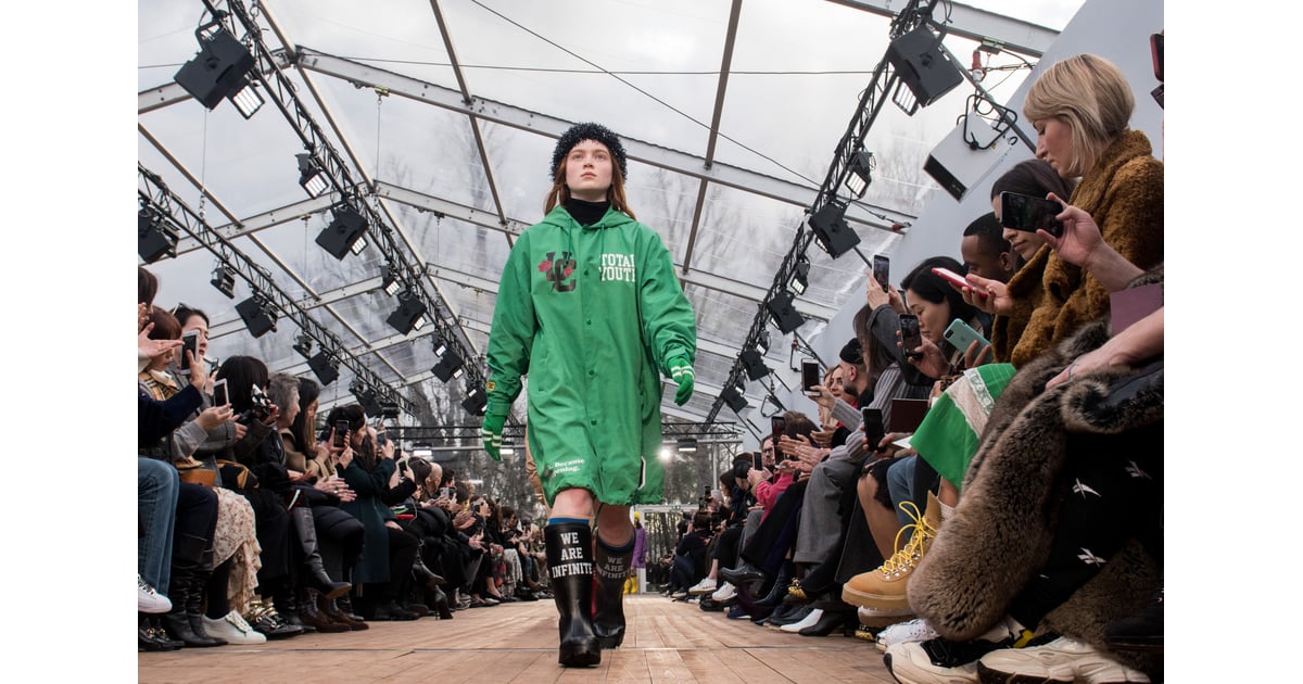 Sadie Sink in an Undercover raincoat and matching rain boots. 29