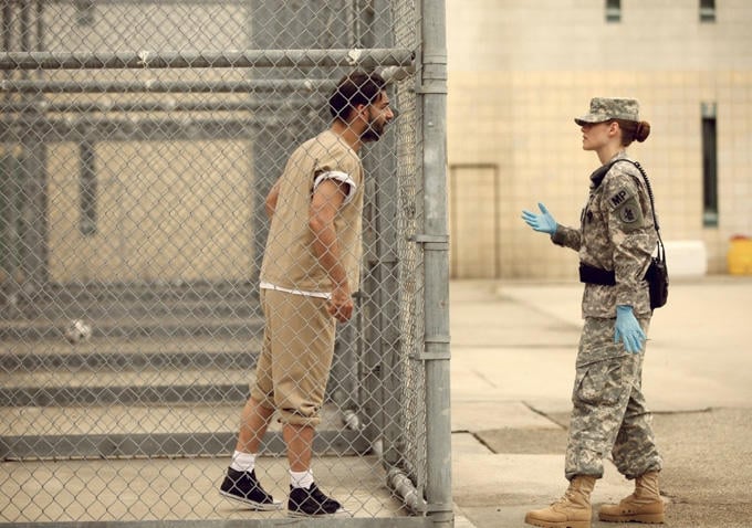 Cole interacts with a Guantanamo Bay prisoner.
Source: Gotham Group