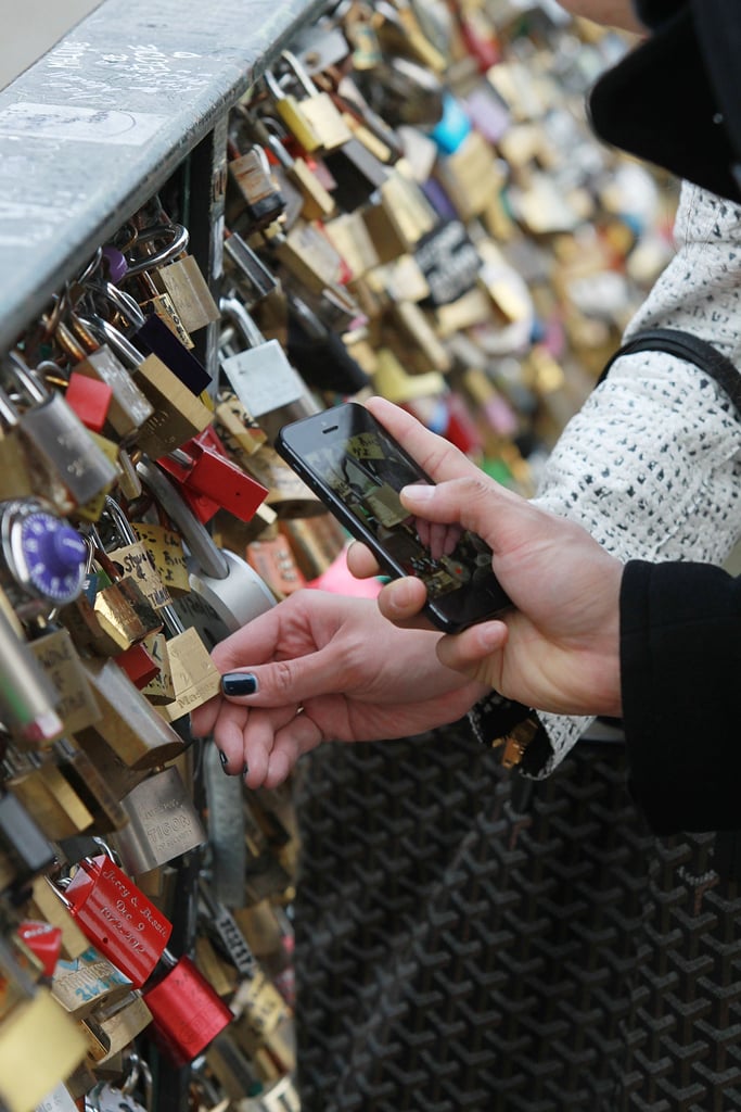 People took photos of padlocks on the Pont des Arts in Paris.
