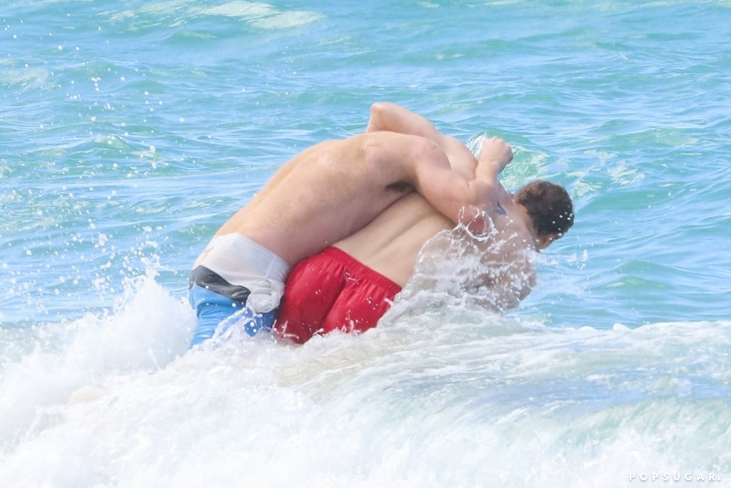 Charlie Hunnam and Garrett Hedlund Wrestle in Hawaii Photos