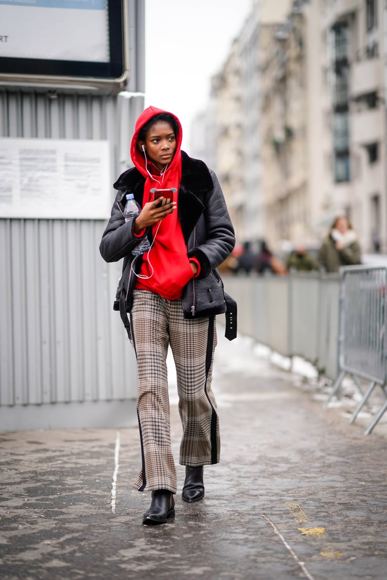 Team Your Black Boots With Plaid Pants and a Red Hoodie