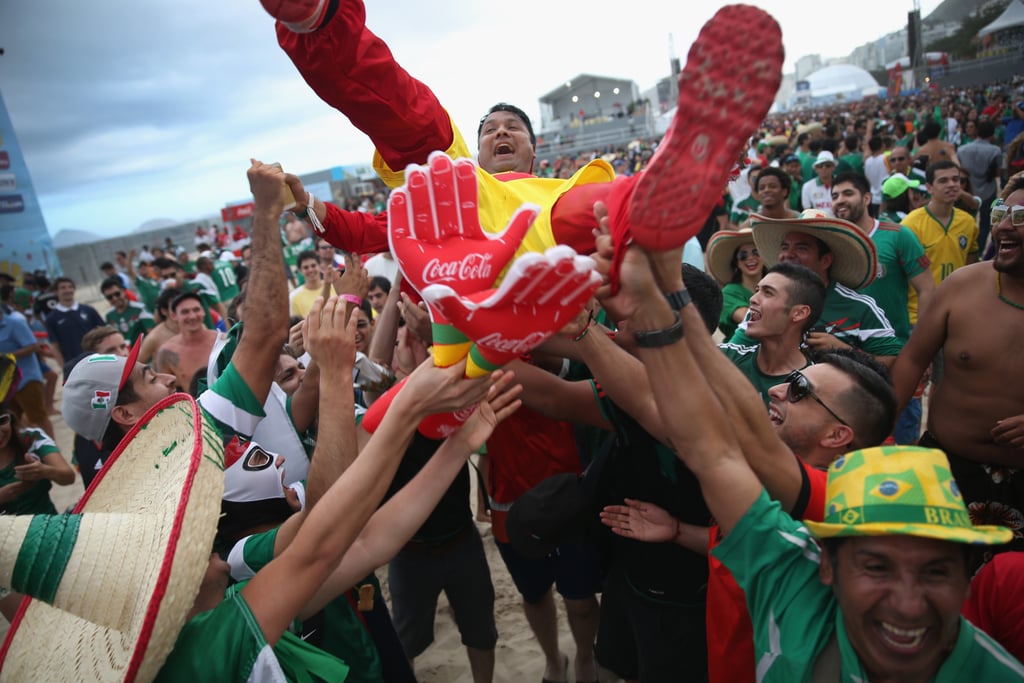 A Mexico fan crowd-surfed on Copacabana Beach in Brazil.