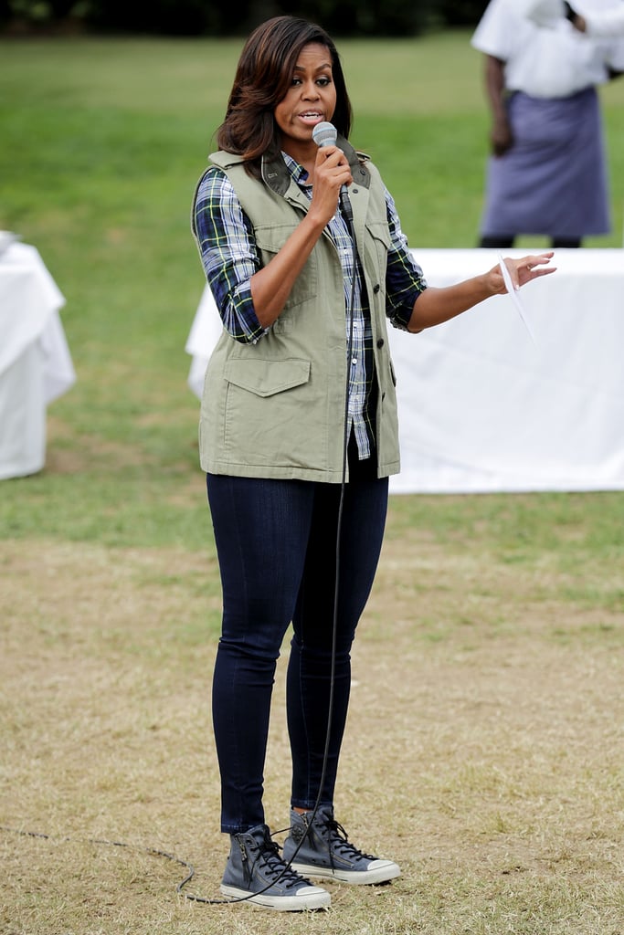 Skinny jeans were Michelle's top choice when she attended a harvesting event at the White House Kitchen Garden. She wore them with a checked shirt, a sleeveless jacket, and a pair of leather Converse.