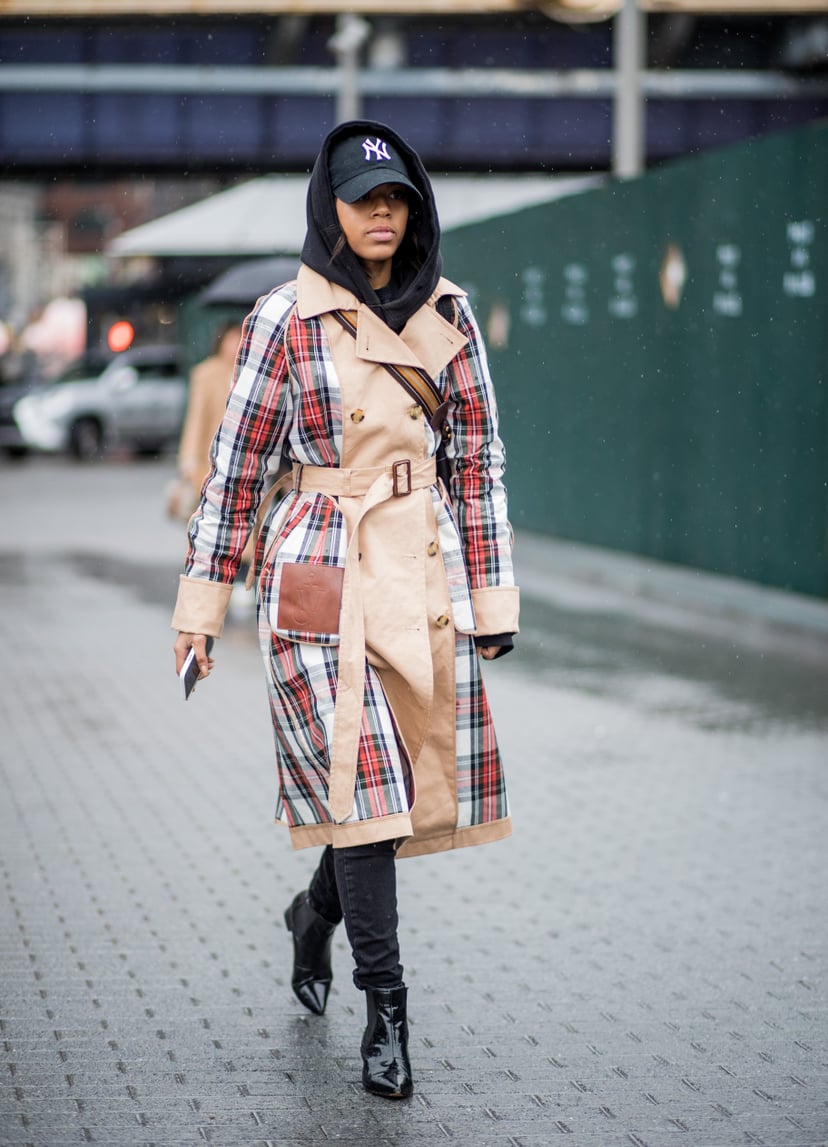 NEW YORK, NY - FEBRUARY 11: A guest wearing plaid J.W. Anderson trench coat seen outside Tibi on February 11, 2018 in New York City. (Photo by Christian Vierig/Getty Images)