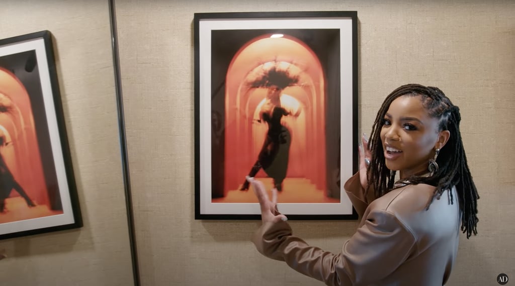 Her entrance hallway features other meaningful pieces of artwork, including this abstract photo from her "Have Mercy" music video shoot.