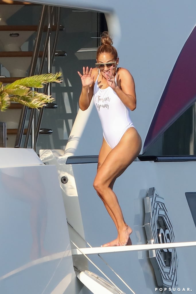 Jennifer Lopez White Swimsuit That Says "Forever Young"