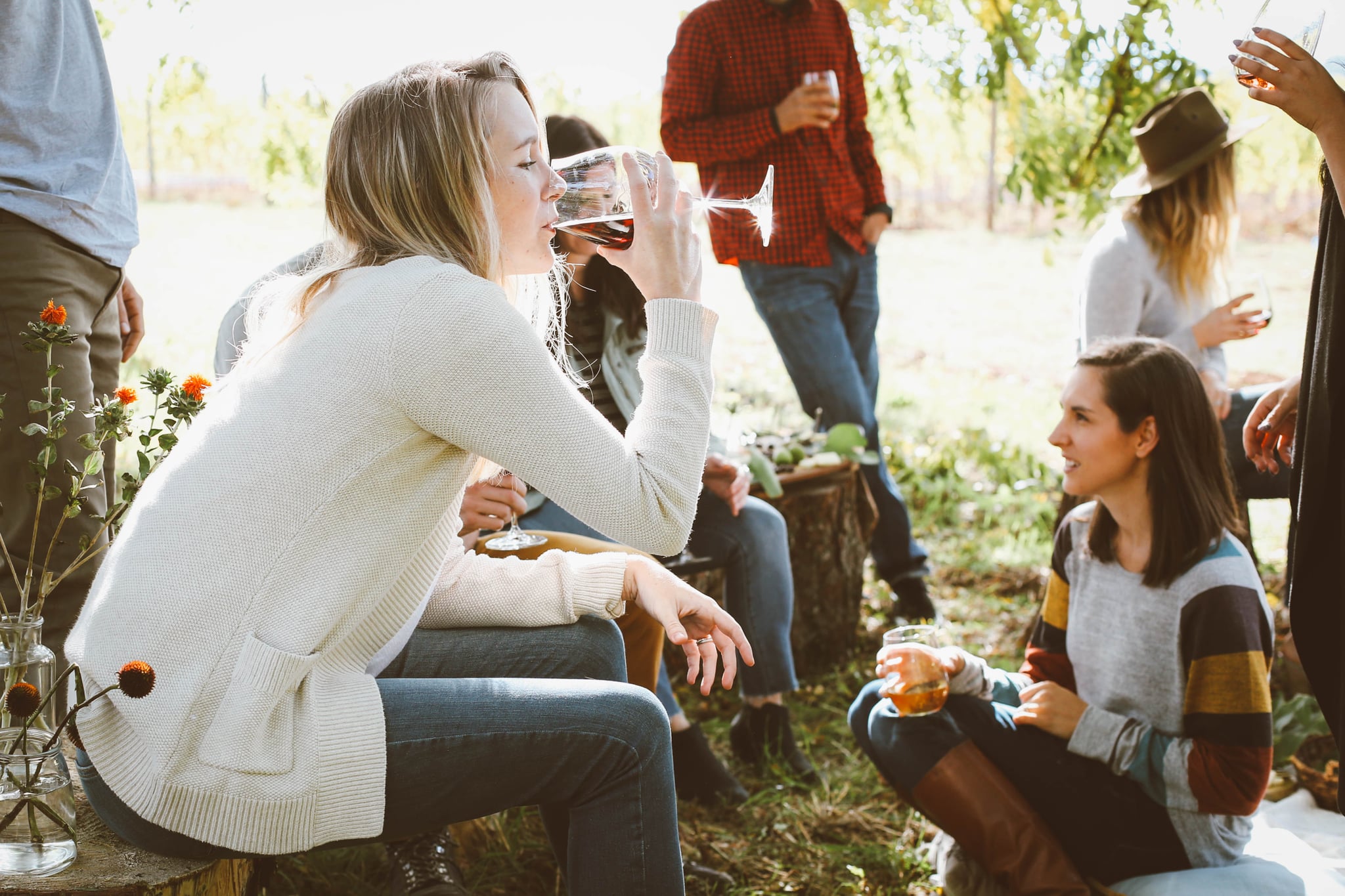 Friends Drinking wine outside during the Fall equinox