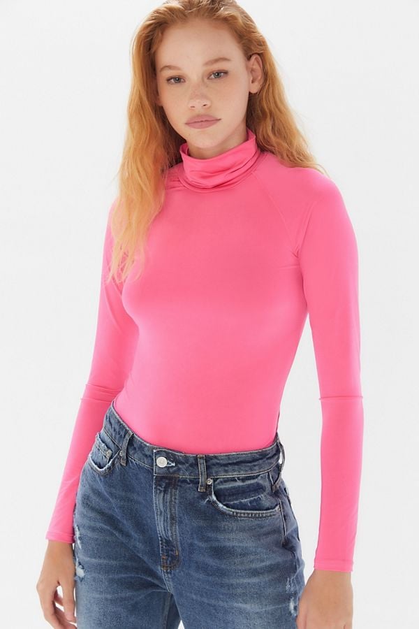 UO Project Social T Shiny Turtleneck Top | Selena Gomez Wears a Light Pink Turtleneck Twice in 