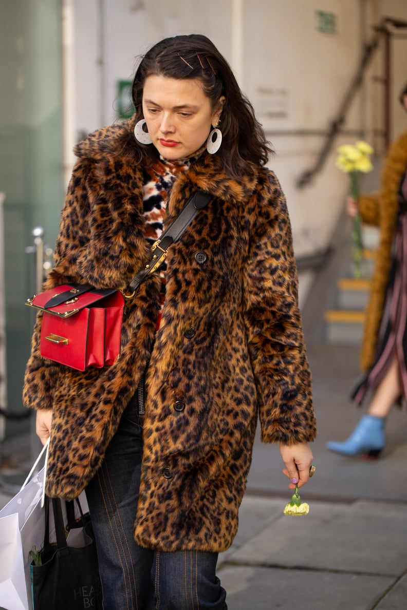 Style Your Leopard-Print Coat With: A Printed Top, Jeans, Bright Bag, and Statement Earrings