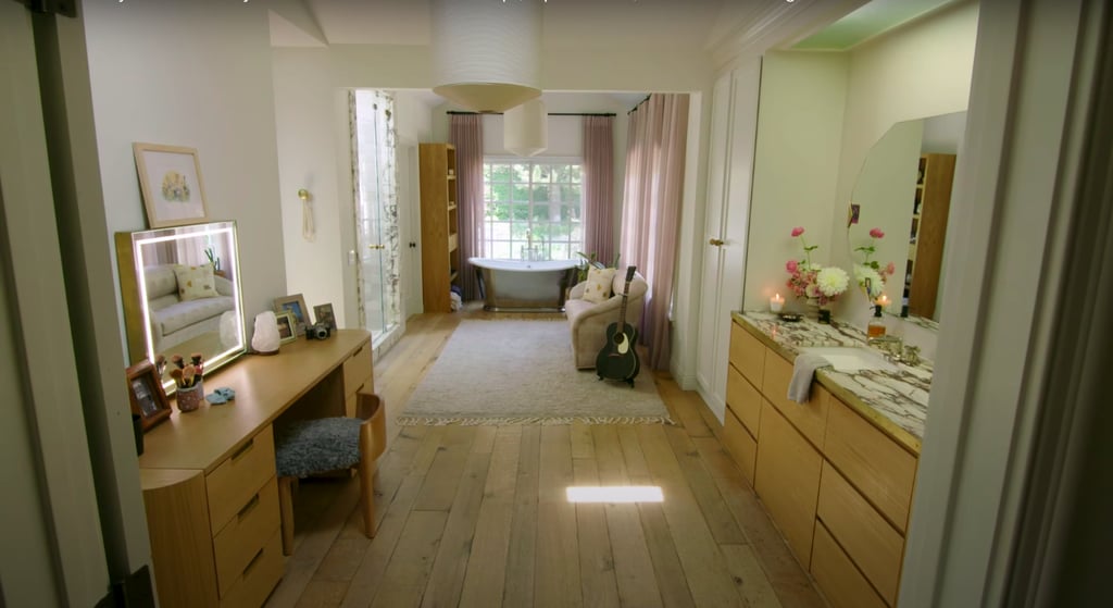 This bathroom is Hilary's sanctuary. She can do her makeup at the vanity, practice guitar on the couch, and relax in the tub. It's also where she gave birth to her daughter, Banks, in 2018.