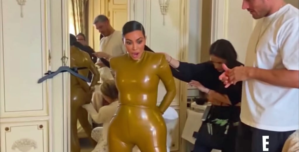 Watch Kim Kardashian Squeeze Into Her Latex Balmain Outfit