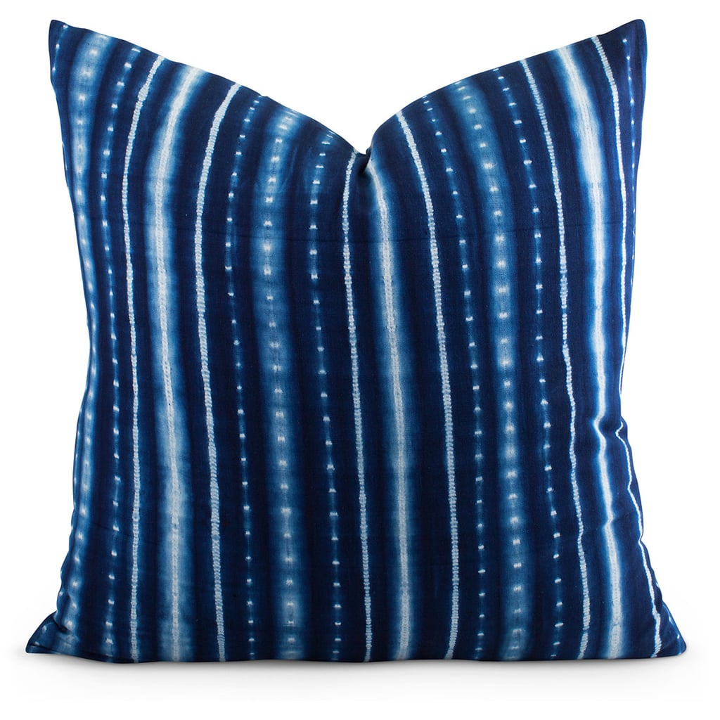 Part classic stripe, part boho tie-dye, this shibori pillow ($65) is a surprisingly versatile way to give any sofa or bed a hip makeover. Style it with other blue-and-white patterned pillows for a summery update. 
— AE