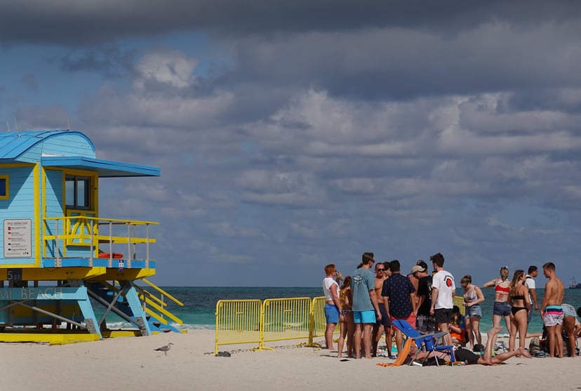 MIAMI BEACH, FLORIDA - MARCH 16: People enjoy themselves on the beach on March 16, 2021 in Miami Beach, Florida. College students have arrived in the South Florida area for the annual spring break ritual. City officials are concerned with large spring bre