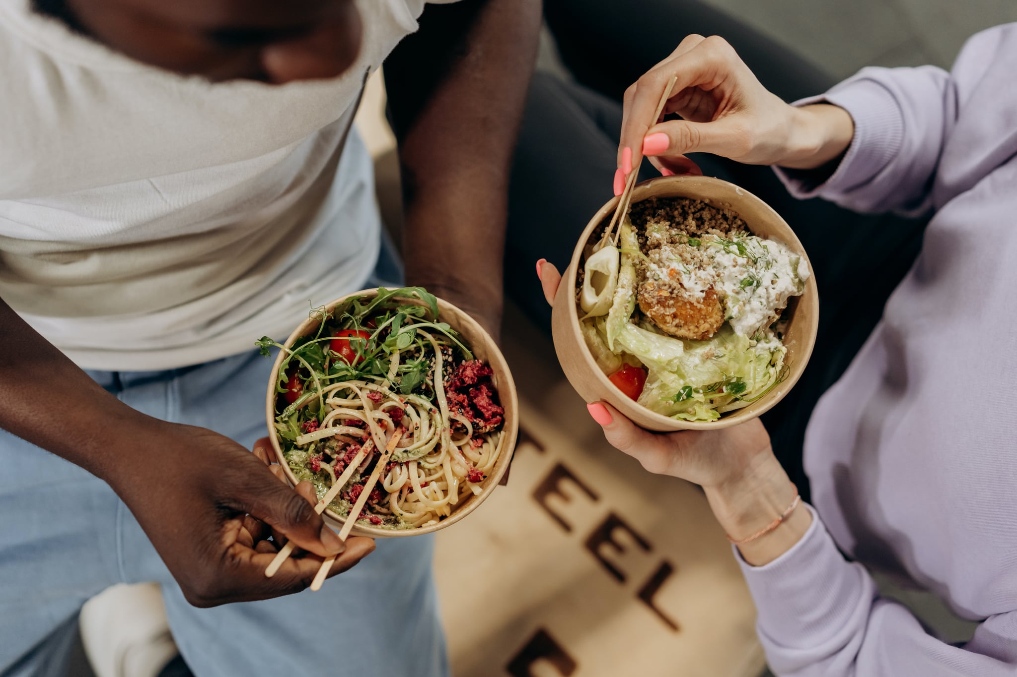 two people eating colorful bowls of food to signify hormone balancing trend on TikTok