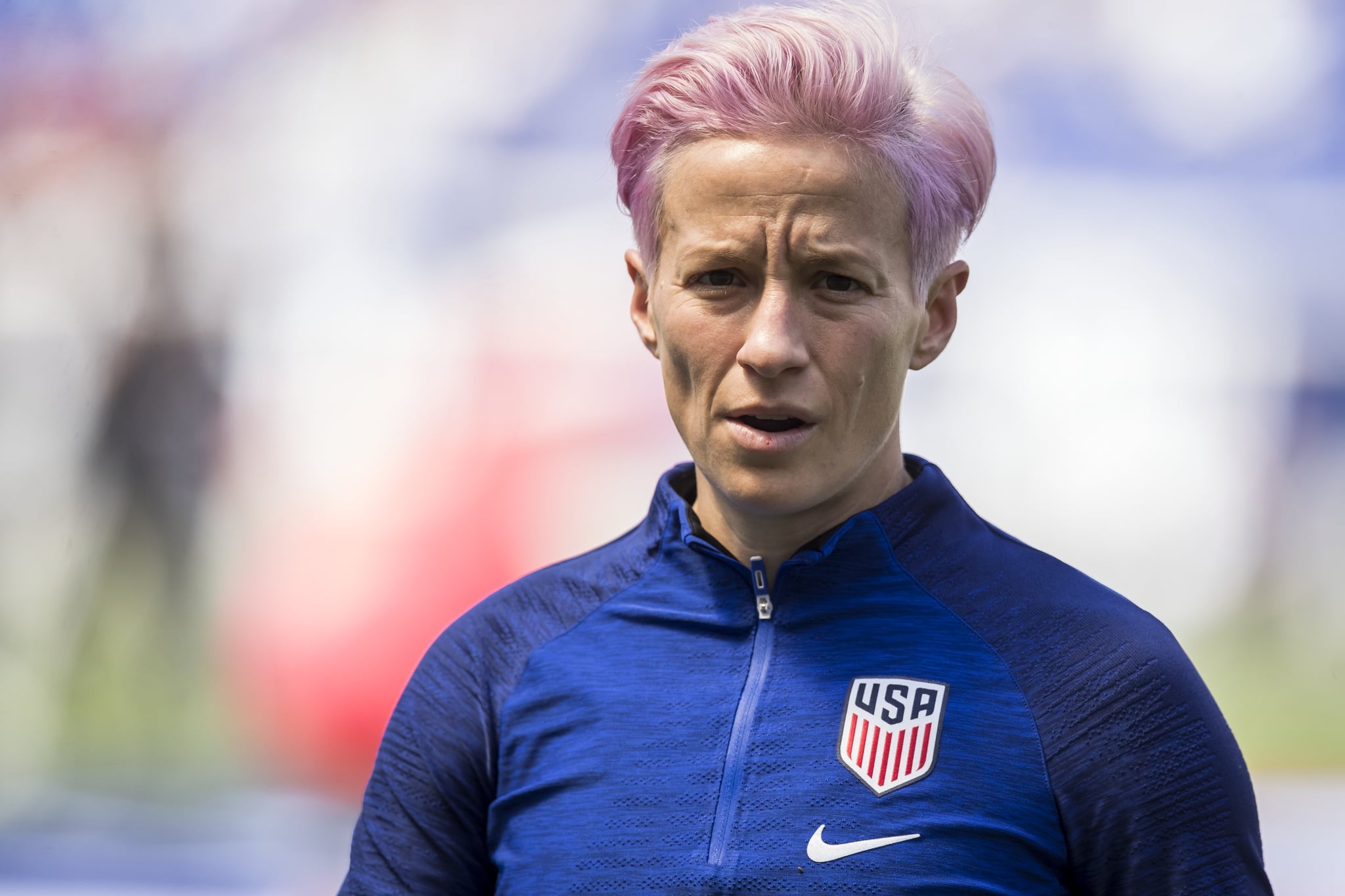 HARRISON, NJ - MAY 26: Megan Rapinoe #15 of United States with pink dyed hair looks at the camera as she warms up at the start of the International Friendly match the U.S. Women's National Team and Mexico as part of the Send Off Series prior to the FIFA Women's World Cup at Red Bull Arena on May 26 2019 in Harrison, NJ, USA. The United States Women's National team won the match with a score of 3 to 0.  (Photo by Ira L. Black/Corbis via Getty Images)