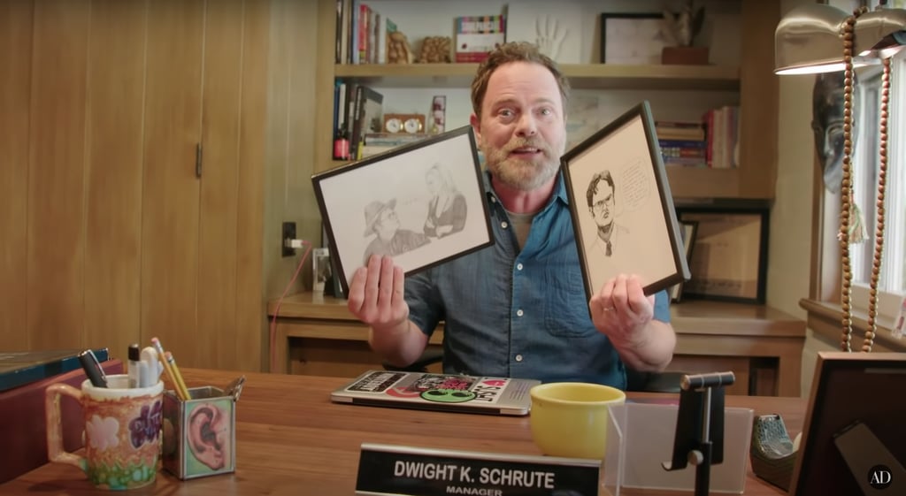 Yep, Rainn has a Dwight K. Schrute nameplate proudly situated on his office desk, along with hand-drawn art made by The Office fans.