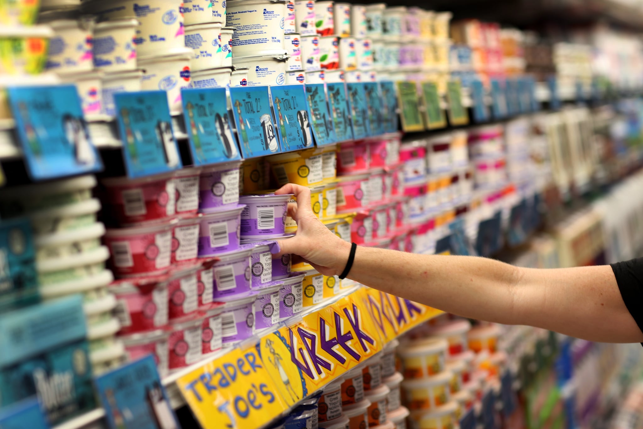 PINECREST, FL - OCTOBER 18: Dawn Moreno shops for yogurt as she enjoys the grand opening of a Trader Joe's on October 18, 2013 in Pinecrest, Florida. Trader Joe's opened its first store in South Florida where shoppers can now take advantage of the California grocery chains low-cost wines and unique items not found in other stores. About 80 percent of what they sell is under the Trader Joe's private label. (Photo by Joe Raedle/Getty Images)